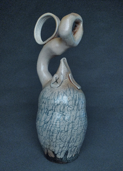 A picture containing vessel, ceramic ware, jar, stoneware

Description automatically generated